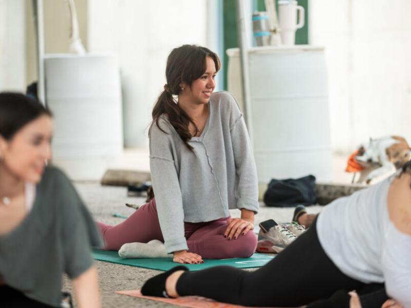 Students taking goat yoga as part of LiveWellSEU